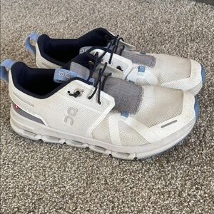 On Running Cream and Blue Athletic Shoes